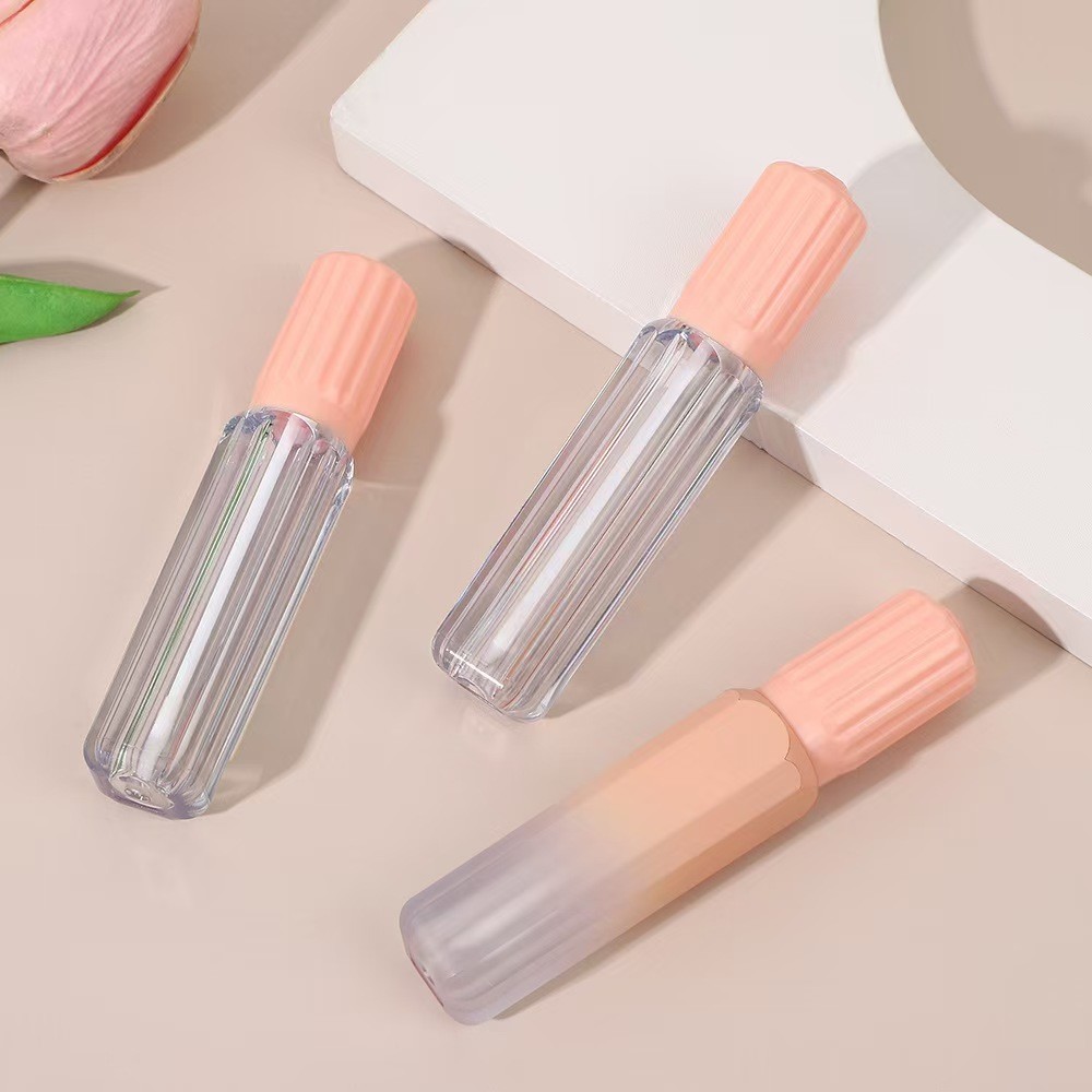 Design gear cover with brush plastic lip glaze tube in various colors