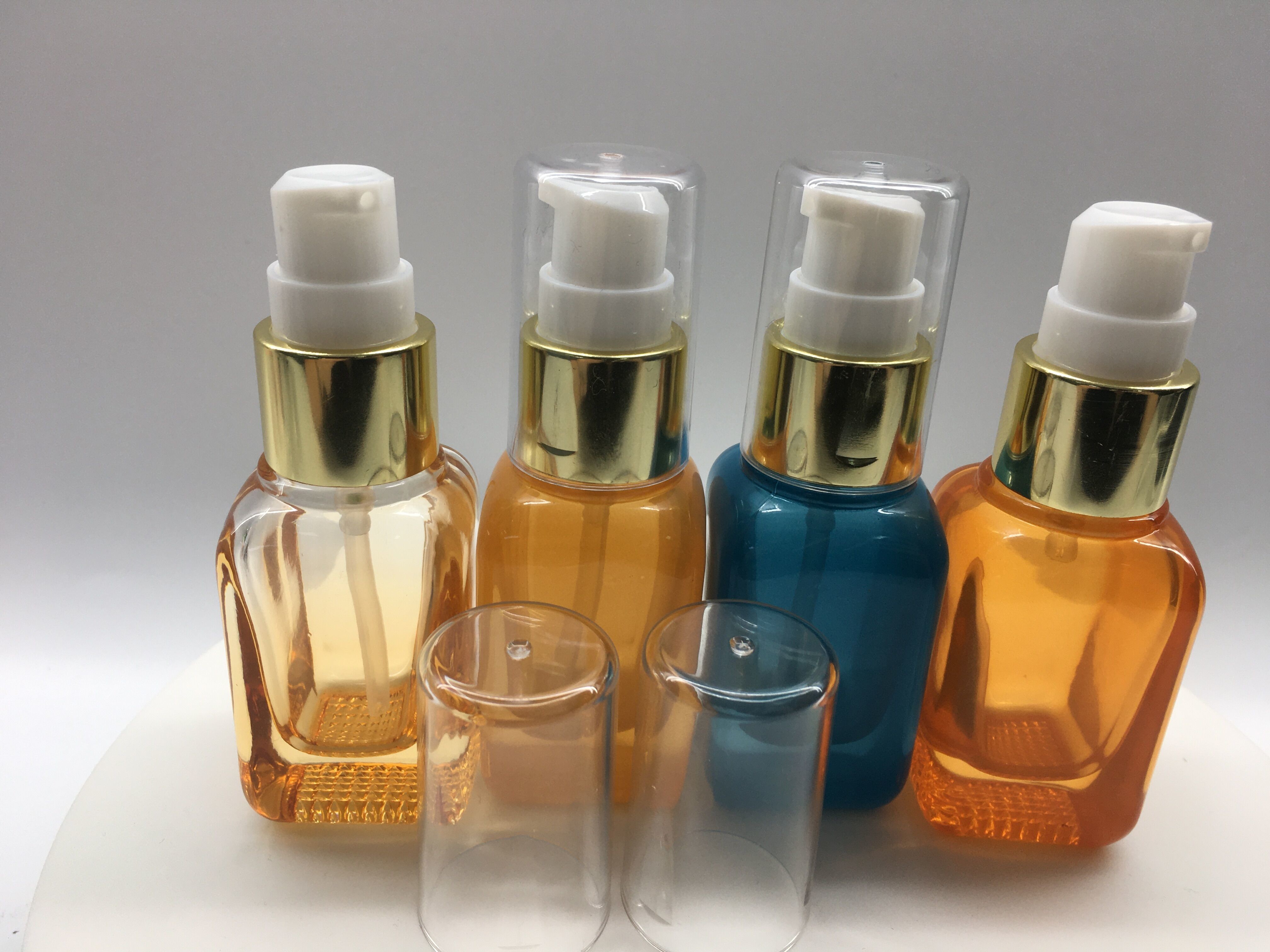 SGS ISO MSDS Orange Blue 20ml Glass Pump Bottle For Lotion And Serum