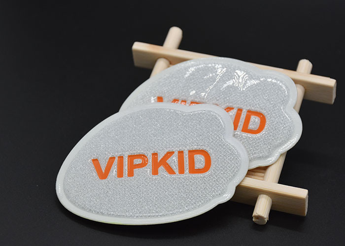 Debossed Shiny Pressed TPU printed label Custom Logo For Garments