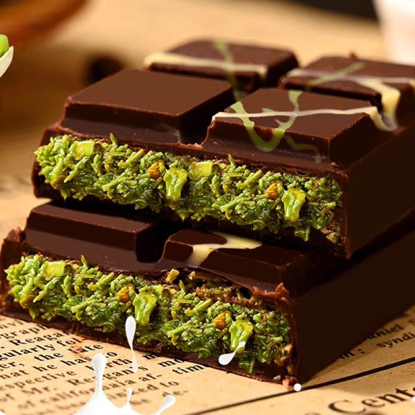 Close-up of Dubai style compound chocolate pieces with bean pattern