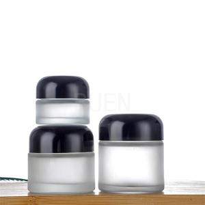 China Forsted Glass Empty Cosmetic Jars Round, Shinny Black Cap Travel Cosmetic Jar wholesale