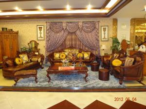 China Antique Frame Chesterfield Carved Wood And Leather Sofa Set wholesale