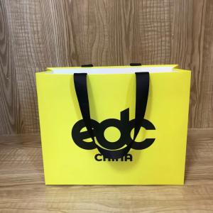 China 175gsm Lotus Color Goose Yellow Garment Paper Bags For Clothing Store wholesale