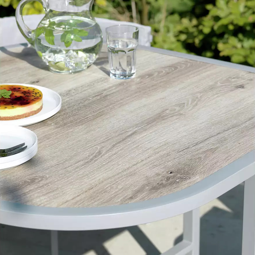 Maximize Your Outdoor Space with this Space Saving Rattan Weave and Steel Dining Set