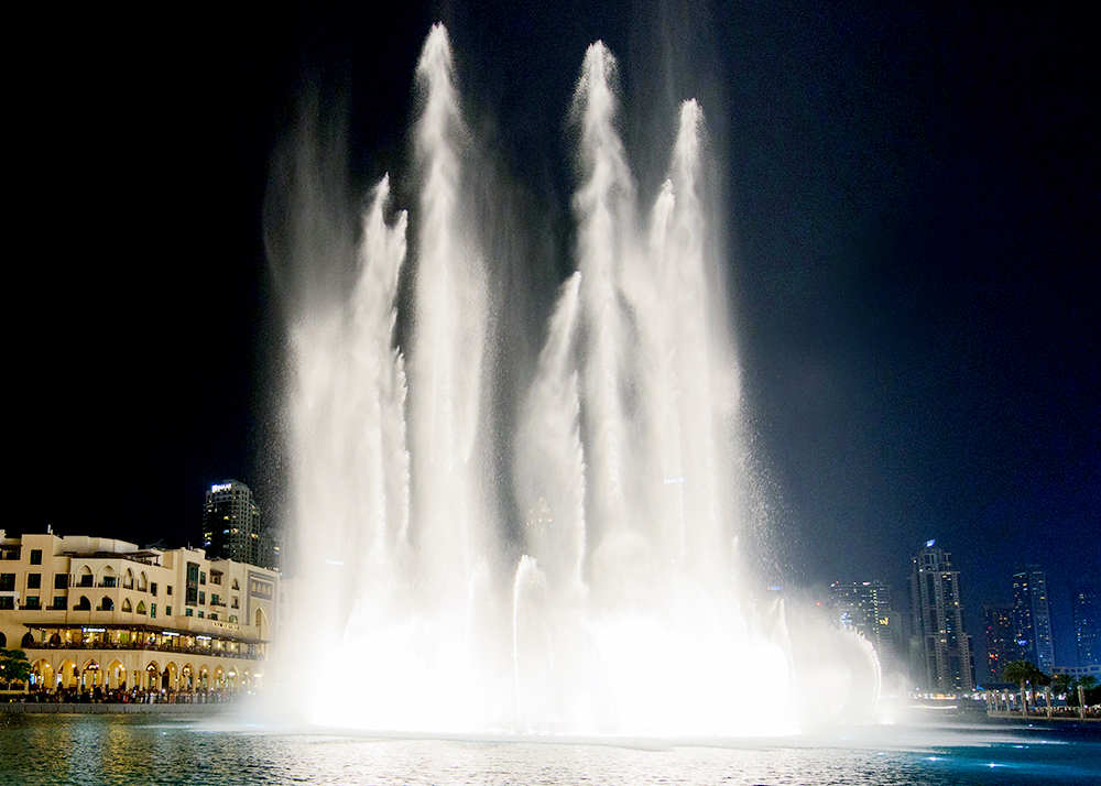 large music dancing water fountain on the water surface