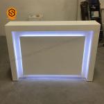 China Unique Design Beauty Salon Front Desk LED Light Solid Surface Reception Counter for sale