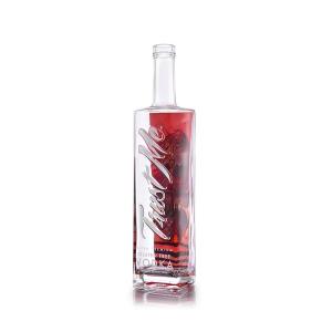China Embossed Lettering Luxury Spirits Bottle 900g 750ml Clear Glass Bottles wholesale
