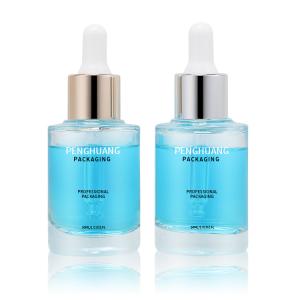 China Round Massage Oil Glass Dropper Bottle Serum Pipette 30ml Clear Glass Face Skincare Bottle on sale