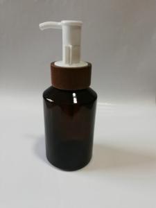 China Reusable Eliquid Oil Black Cosmetic Bottles Oblique Shoulder Wood Pump wholesale