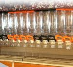 candy dispenser mounted on wall in suppermarket