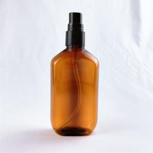 China Boston Round Glass Bottle With Treatment Pump Clear Amber Empty Boston Essential Oil Bottle wholesale