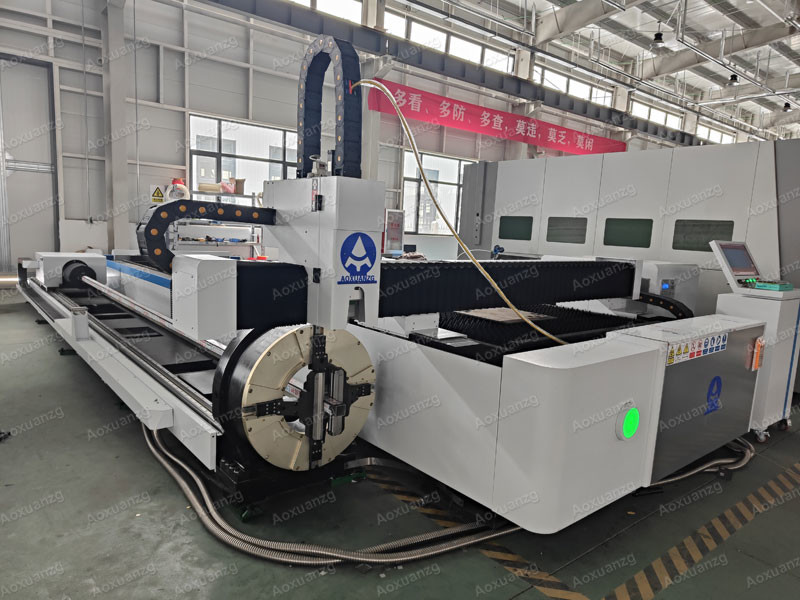 Open Type 3015 Three Chuck Tube And Plate Fiber Laser Cutting Machine 3000w CNC Laser Cutter With Exchange Platform