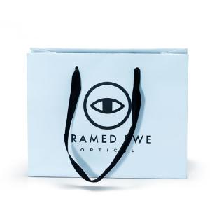 China Durable high quality promotion gloss glasses packaging paper bag wholesale