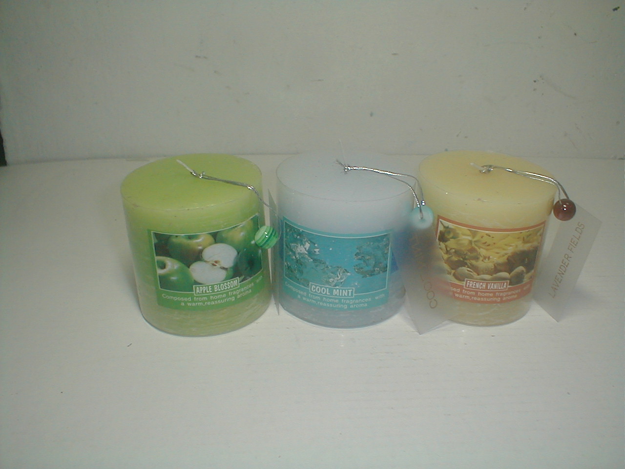 3x3" Purple,orange & red scented pillar assorted candle packed by pvc sheet and printed label