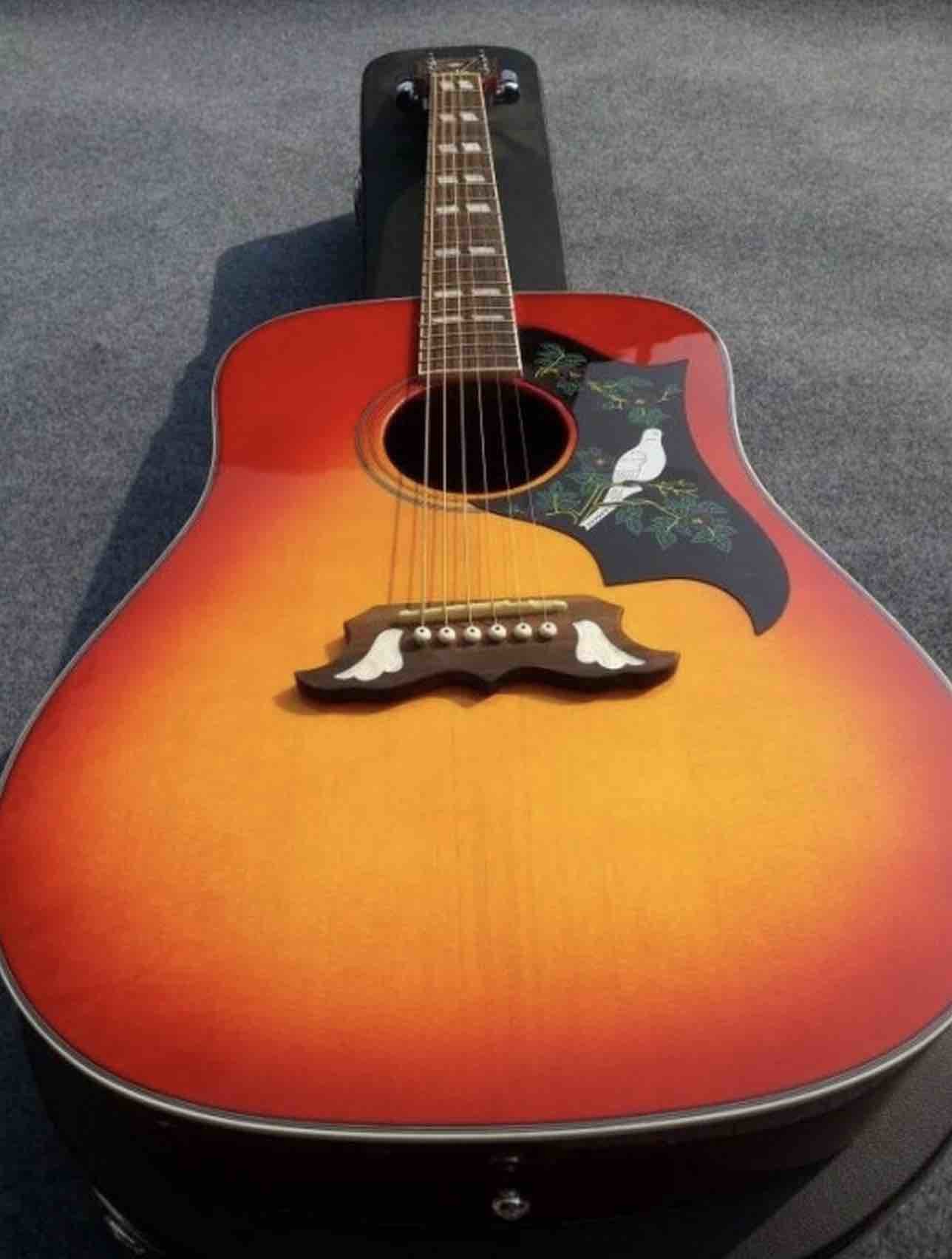 2018 Orange Sunburst Dovo acoustic guitar