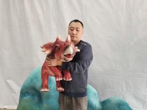 China Hand Control Baby Animatronic Dinosaur Triceratops Puppet for Sale wholesale