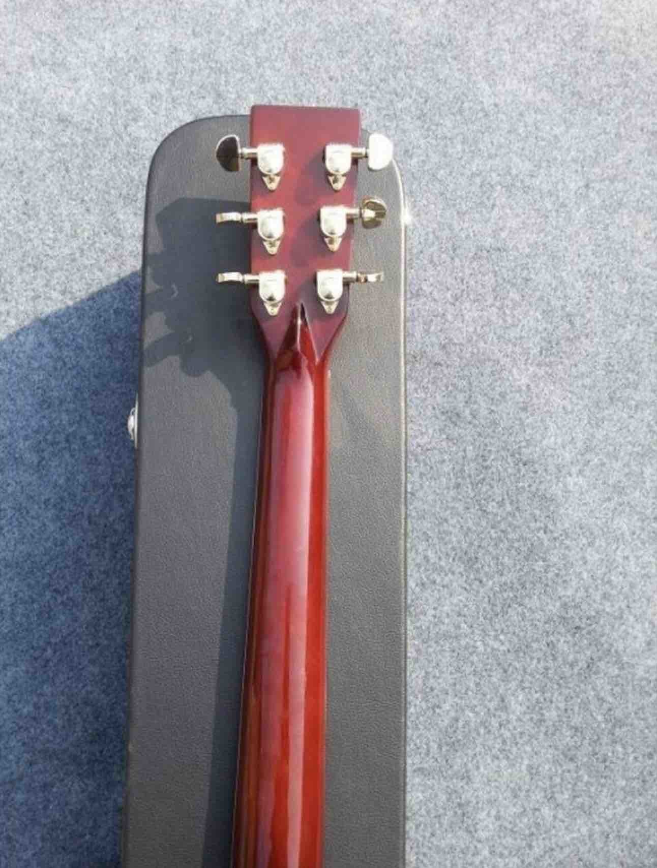 2018 Orange Sunburst Dovo acoustic guitar