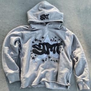 China Puff Print Jacket Fleece Cotton Cropped Cut Edge Raw Hem Puff Printing Hoodie Men wholesale