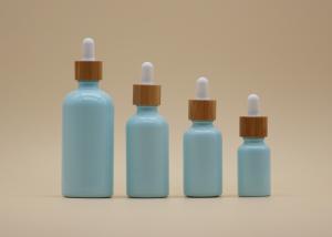 China Color Coating Sky Blue 15ml 30ml Essential Oil Bottles With Bamboo Dropper wholesale