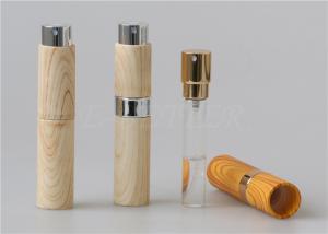 China Travel Size Twist And Spritz Atomiser 10ml Plastic Mini Spray Bottle Wood Grain Surface wholesale