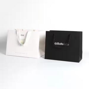 China Customizable Logo Paper Packaging Bags With Silk Ribbon Handle wholesale