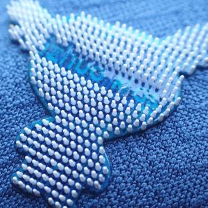 China Eco-friendly silicone dot heat transfer garment labels wholesale