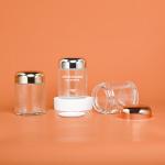 Round 100g Capsule Glass Container With Rose Golden Cap Sliver Cap Glass Jar