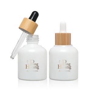 China Cosmetic Serum Essential Oil Glass Bottle 30ml Empty Bamboo Dropper wholesale