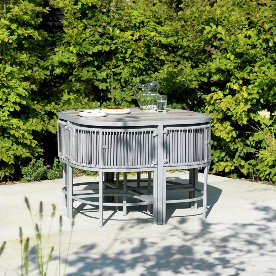 Maximize Your Outdoor Space with this Space Saving Rattan Weave and Steel Dining Set