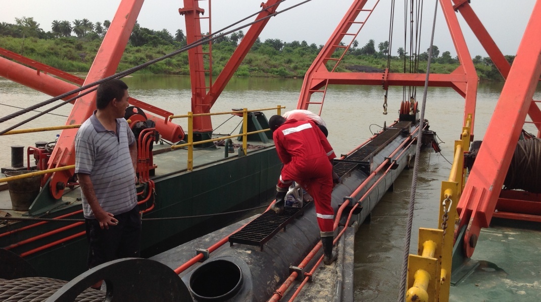 Technical team working on dredging ship assembly