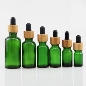 China 100ml Essential Oil Glass Cosmetic Bottle With Bamboo Dropper Care Skin Brown wholesale