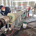 Vacuum Cooling Water Tank Pipe Extrusion Machine 75KW-185kw Plastic Tube Making