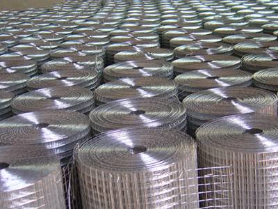 Galvanized welded wire mesh rolls in warehouse