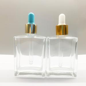 China OEM 50ml 100ml Cosmetic Dropper Bottles With Gold Shinny Collar wholesale