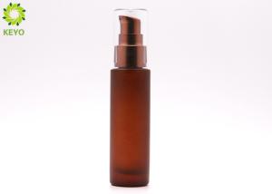 China Brown Glass Cosmetic Essential Oil Bottle With Electroplating Brown Plastic Pump Cap wholesale