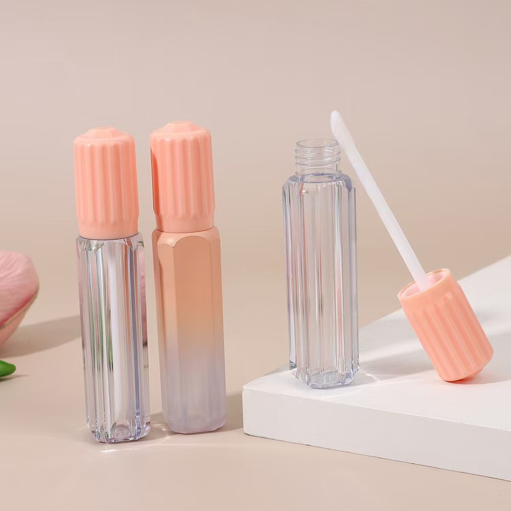 Design gear cover with brush plastic lip glaze tube in various colors