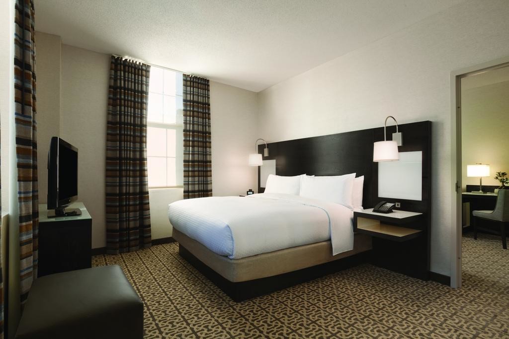 Hotel Executive Suite Bedroom Furniture Double Bed with TV storage Cabinets by Dark oak wood and Reception Living Sofa