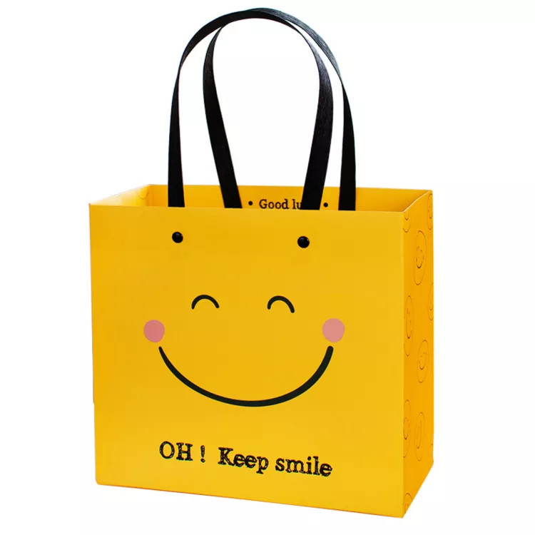 ISO Shock Resistant Smile Face Kraft Paper Bags Yellow Square Bottom Paper Bag