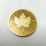 Fake gold coin with tungsten maple leaf logo