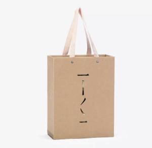 China Custom Luxury Gift Garment Paper Shopping Bags With Logo Print wholesale
