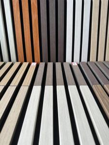 China Wooden Grille Akupanel Authentic Wood Veneer Finishes Interior Decoration Wall Panel wholesale