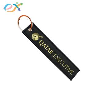 China Polyester Material Woven Keychain Black Bottom Yellow Words With Metal Key Ring wholesale