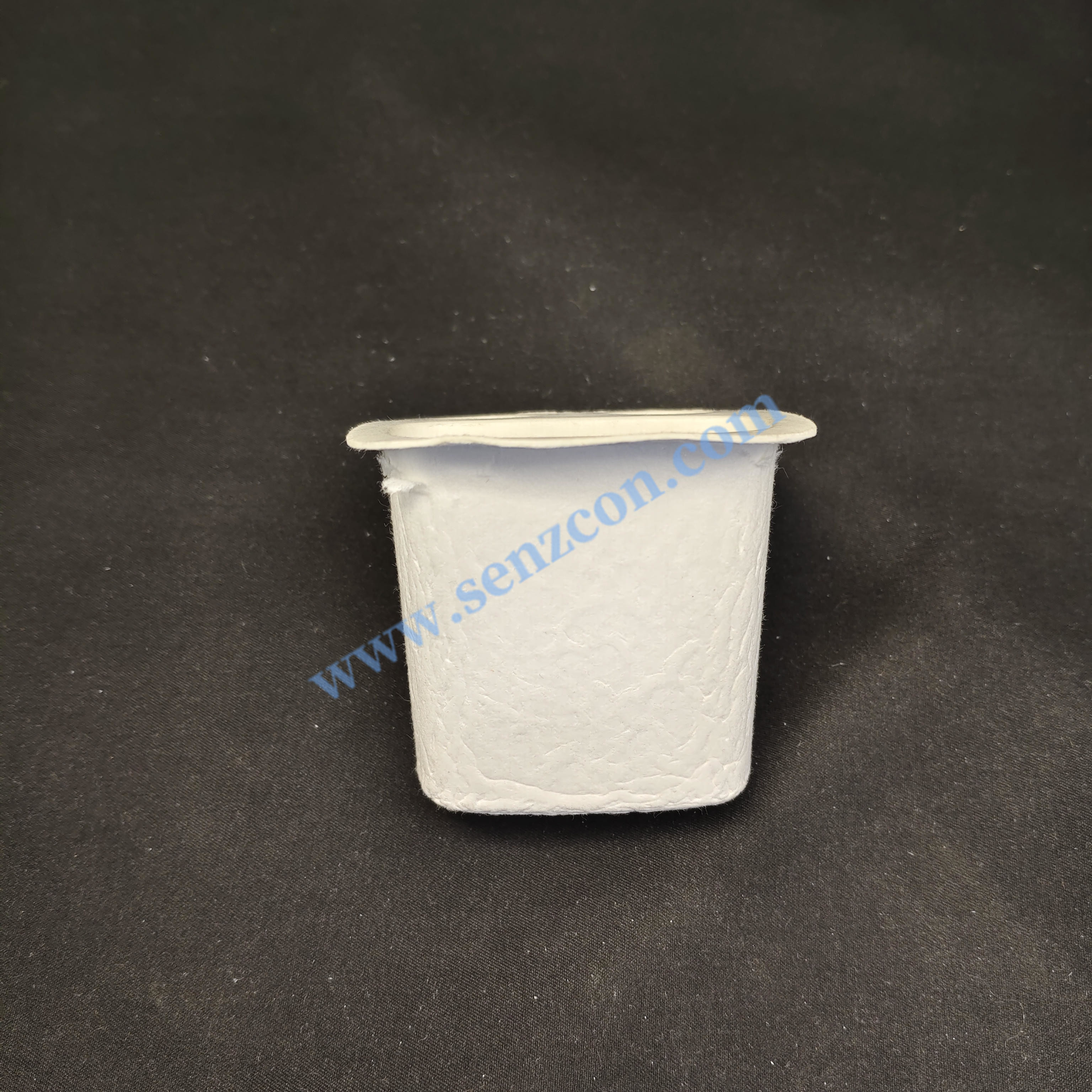 Custom-made in a Ningbo factory: Pulp molded base for electronic product earphones. Made of white plant fiber and sugarcane pulp, it is environmentall