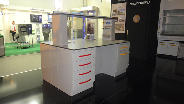 Glare surface octagonal corner countertop with corrosion protection for testing center