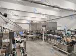 PLC Control Automatic Packaging Line For High Capacity Production 35-150 Bags
