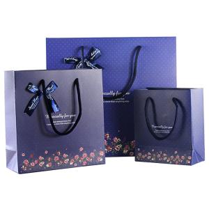 China Durable ivory paper personalized shopping paper bag with logo wholesale