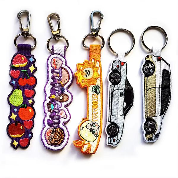 Hot Selling Fabric Embroidery Flight Tag Keyring Backpack Woven Jet Tag Keychain