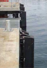 Arch Fenders for Impact Energy Conversion and Protection of Vessels and Docks in Port Facilities with High Traffic