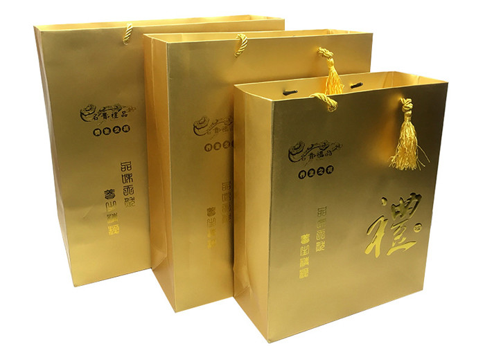 Custom Luxury Printed Gold Paper Gift Bags With Embossed Logo Tassel Handles