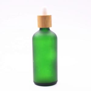 China 18/410 100ml Frosted Green Glass Liquor Empty Essential Oil Bottles Bamboo Dropper wholesale